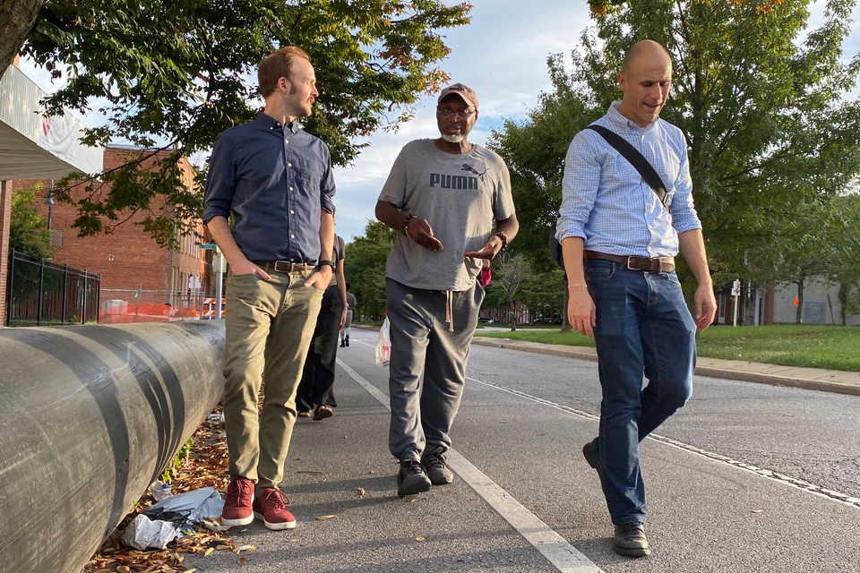 Ben Zaitchik joins community leaders and BSEC colleagues on a walk through Broadway East, taking a stroll next to open sewer lines next to residential areas. Credit: Aman Azhar/Inside Climate News