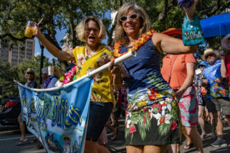 Parrot Heads crowd Mobile's streets to celebrate the life of Jimmy Buffett. Credit: Lee Hedgepeth/Inside Climate News.