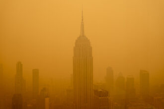 Smoky haze from wildfires in Canada diminishes the visibility of the Empire State Building on June 7, 2023 in New York City. New York topped the list of major cities in the world with the worst air pollution on Tuesday night, June 6 as smoke from the fires blanketed the East Coast. Credit: David Dee Delgado/Getty Images