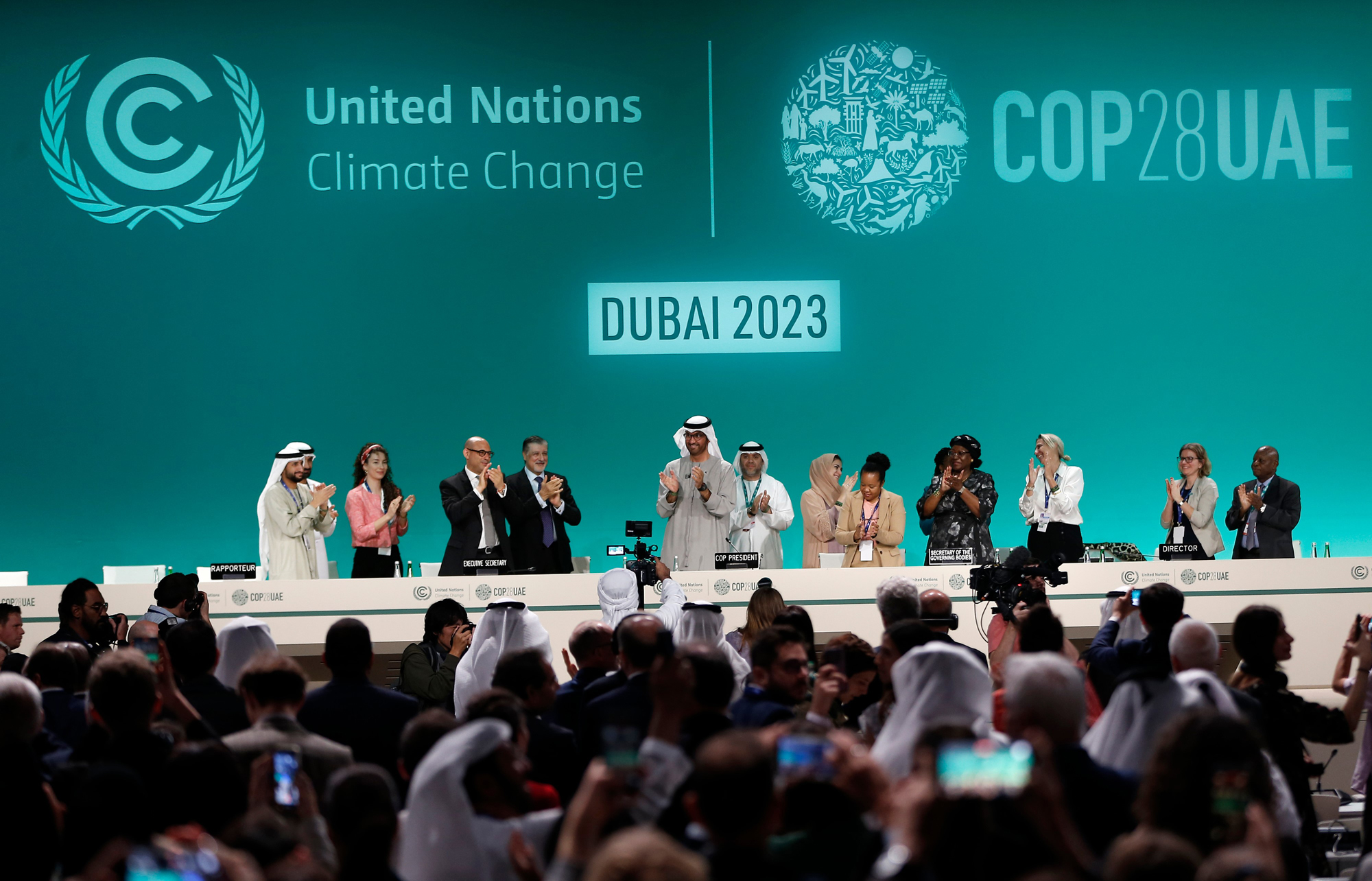 Attendees applaud after announcement of UAE consensus during a closing plenary of COP28 on Dec. 13. Credit: Wang Dongzhen/Xinhua via Getty Images