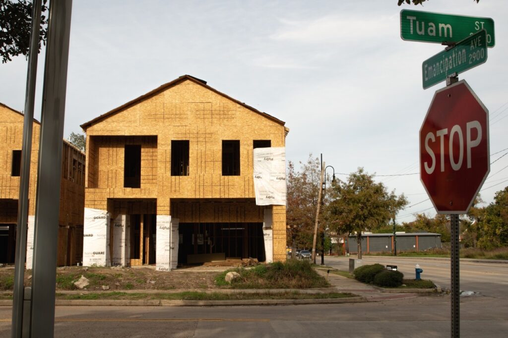 On Houston’s Emancipation Ave., newly constructed homes catering to a new class of Black residents have increased fears of displacement. The average Black household in this historically Black community earns just two-thirds of the average Black household in Texas. Credit: Riot Muse