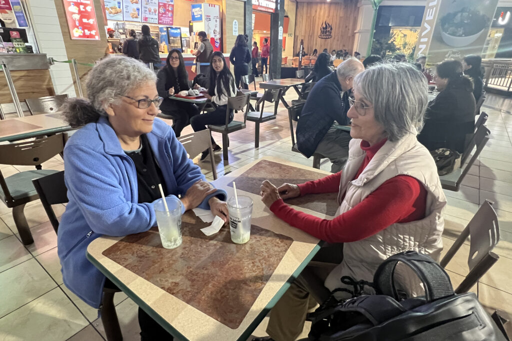 Judith Kimerling and Margarita Yepez, a former Texaco social worker, meet in a food court in Quito and discuss the U.S. multinational's operations in Ecuador. Credit: Katie Surma/Inside Climate News