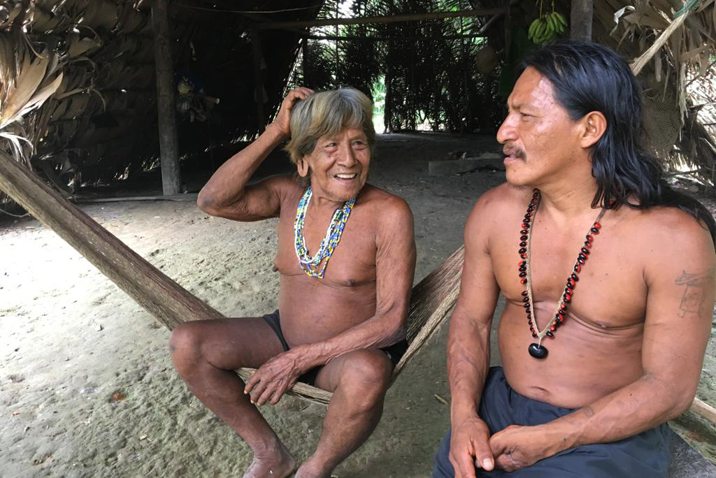 Kemperi Baihua and Penti Baihua talk in Bameno, Ecuador. Credit: Courtesy of Judith Kimerling