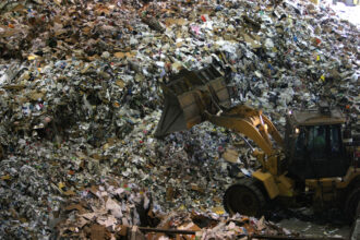 A tractor moves a pile of recyclables at the San Francisco Recycling Center April 22, 2008 in San Francisco, California. Credit: Justin Sullivan/Getty Images