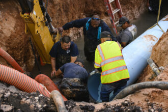 City of Odessa Water Distribution employees work through the night as they attempt to repair a broken water main Tuesday, June 14, 2022 in Odessa. According to Mayor of Odessa Javier Joven, repairs were completed around 3:45 a.m. Wednesday. Credit: Courtesy Odessa American/Eli Hartman.